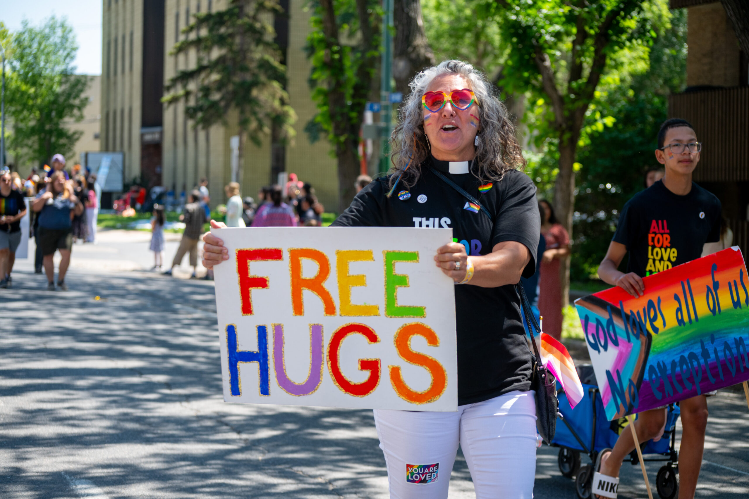 Someone holding a free hugs sign.